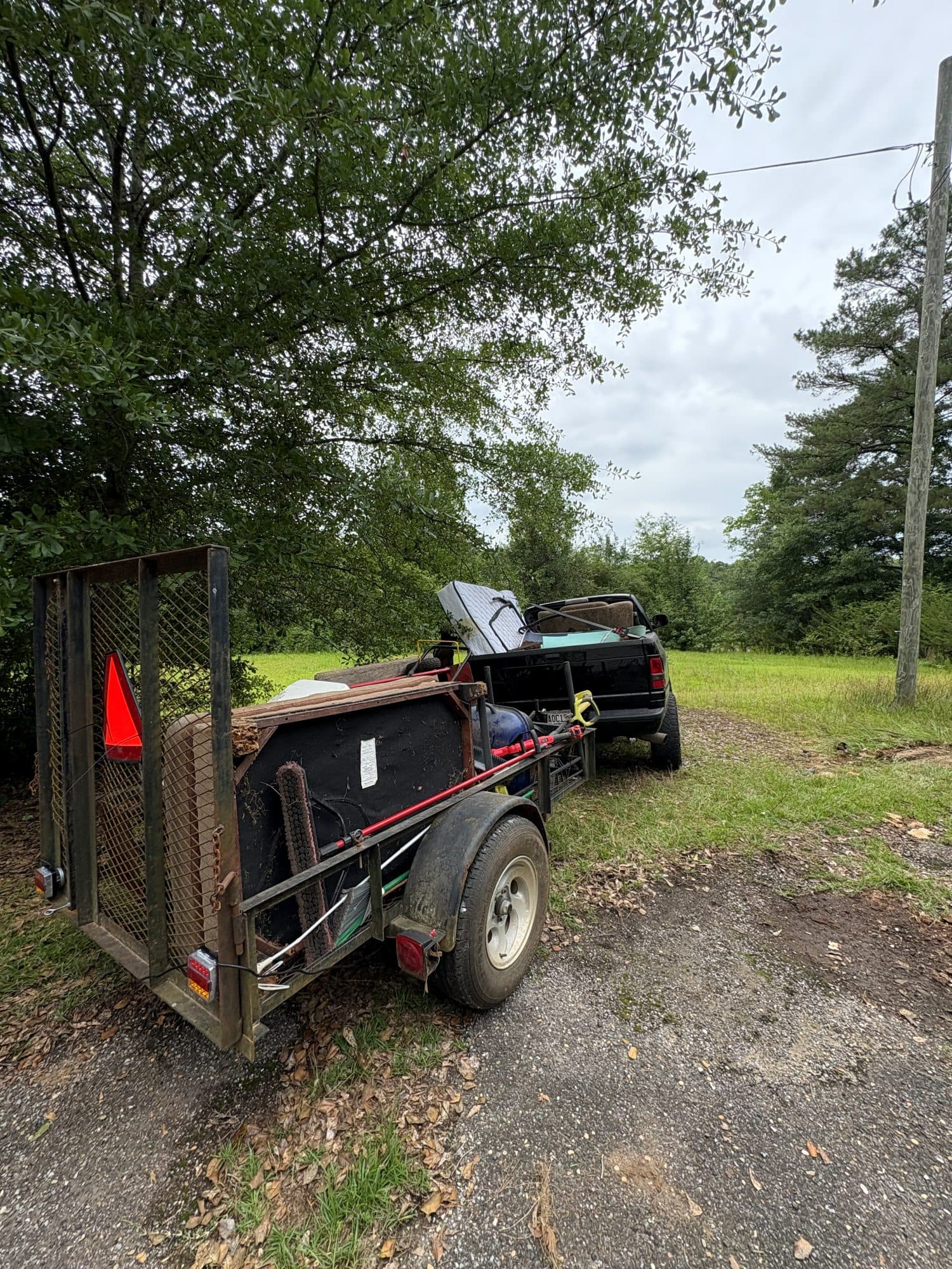Loaded moving trailer hitched behind the Haul Tide truck