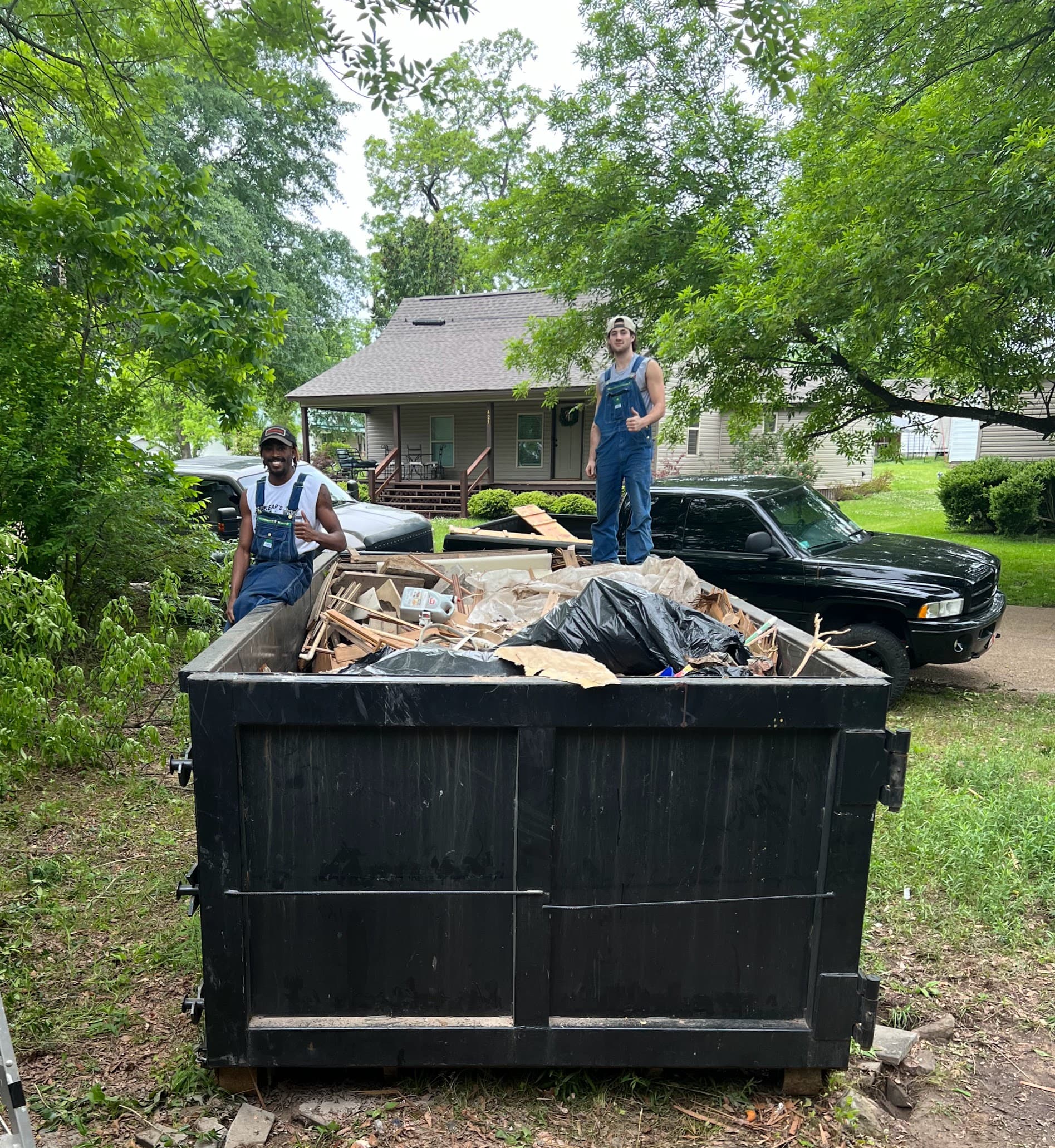 Dumpster loaded with hauled-away junk in Tuscaloosa