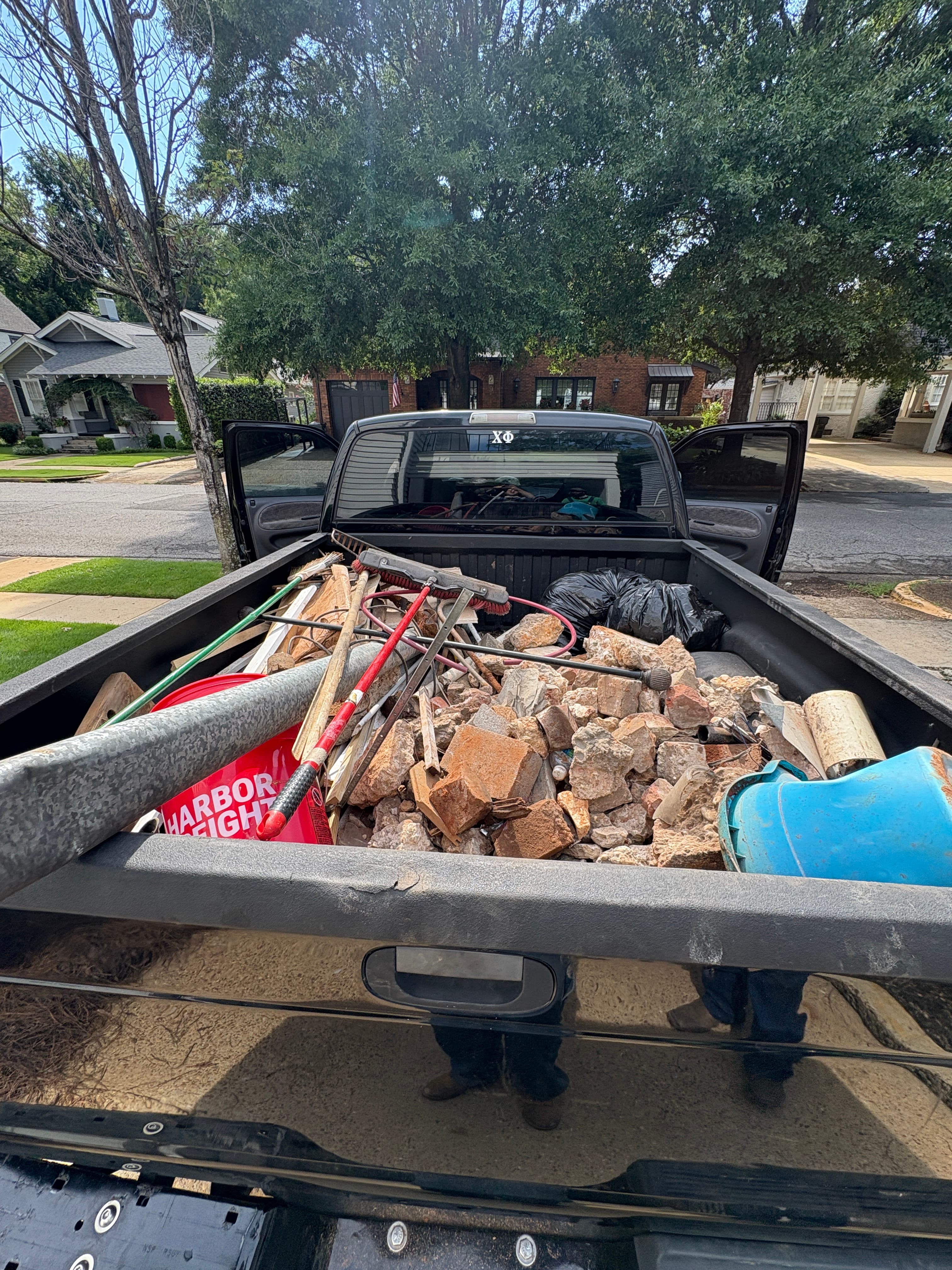 Truck bed filled with junk during a Tuscaloosa junk removal job