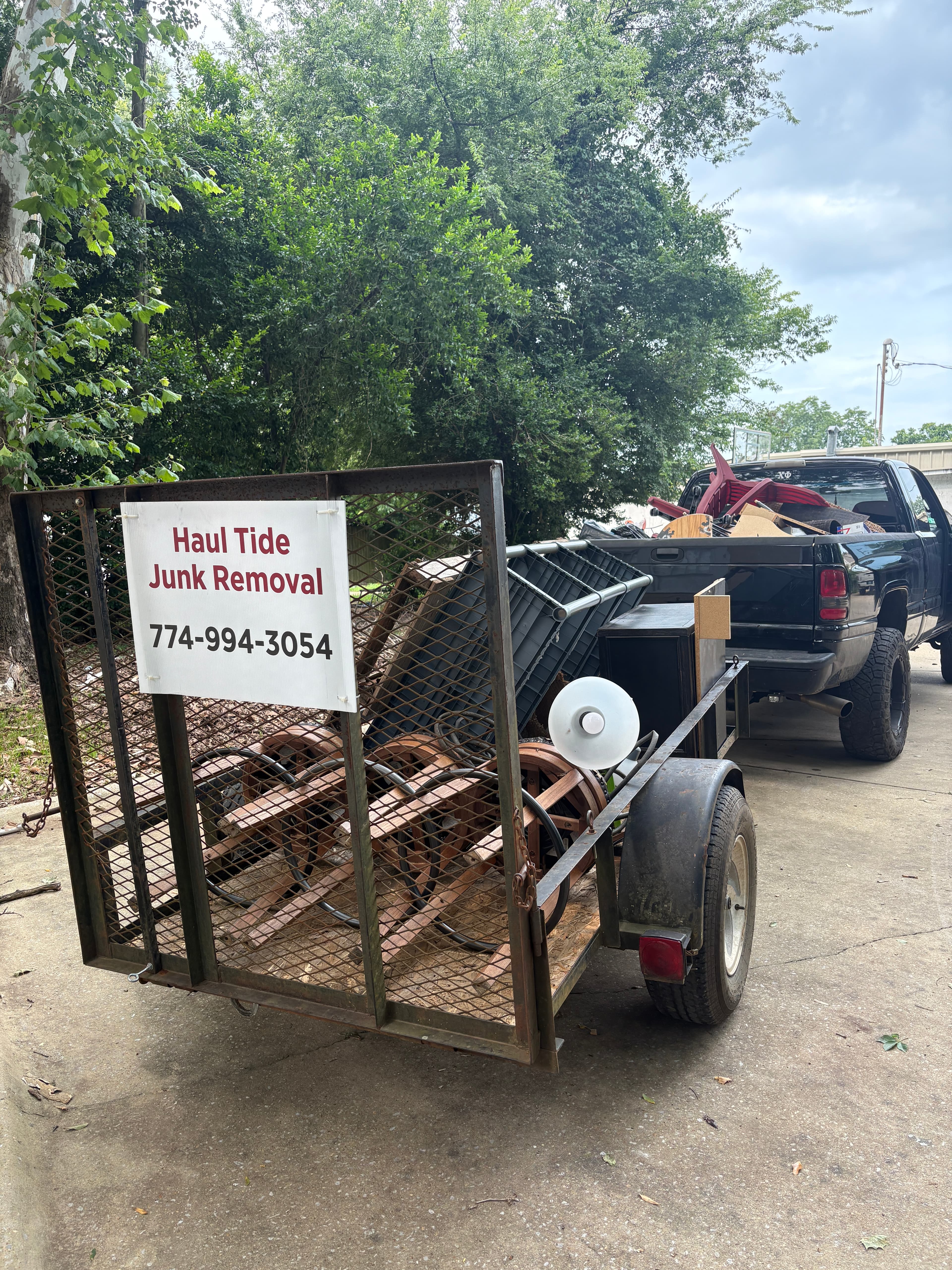 Back of the Haul Tide moving trailer showing company signage